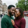 Bola and Tunde laughing together on a London street