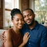 Chidi and Ngozi sitting together at home, smiling at the camera