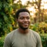 Portrait: Tobi, a Toastly member in Abuja, outdoors at golden hour